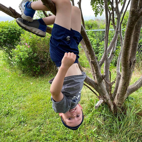 6 year old boy shows bravery and determination while climbing at